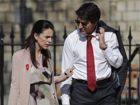 New Zealand Prime Minister Jacinda Ardern (left) talks to Canadian Prime Minister Justin Trudeau as they arrive for the the second day of the Commonwealth heads of government meeting in Windsor, England, on April 20, 2018.