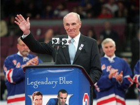 Harry Howell waves to the crowd during a ceremony to retire his jersey No. 3 before a New York Rangers game at Madison Square Garden in New York on Feb. 22, 2009.