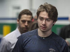 The newest Vancouver Canuck, Quinn Hughes, arrives at Rogers Arena on Wednesday.