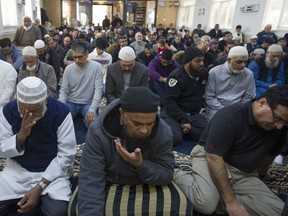 Worshippers attend prayers at the Masjid ur-Rahmah in Surrey on Friday, March 15, 2019. It was the first service since a gunman killed 49 Muslim worshippers in Christchurch, New Zealand.