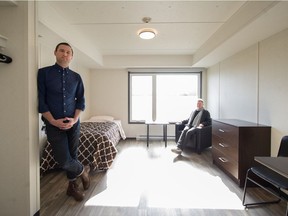 The Portland Hotel Society's Duncan Higgon, project manager, and Tanya Fader, the Community Services Society's interim director of housing, inside Vancouver's newest temporary modular-housing project at Gore and Union in Vancouver on March 5.