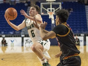 Diego Maffia of Oak Bay Secondary put on a show against W.J. Mouat Secondary of Abbotsford in Wednesday's opening round of the B.C. high school boys' provincial basketball championship at Langley Events Centre.