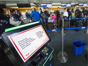 Travellers lined up for their flights inside Vancouver International Airport. Transport Canada issued a safety notice on March 13, 2019, grounding all Boeing 737 Max 8 and 9 aircraft from departing or arriving in Canadian airspace.