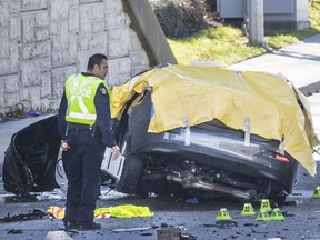 Police investigate a single-vehicle collision  that killed three people on the 32nd  Avenue Diversion under the Highway 99 overpass in Surrey on Tuesday, March 26, 2019.