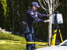 Police continue to carry out forensic work at a house on 35th Avenue in Surrey after a fatal single-vehicle crash Tuesday.
