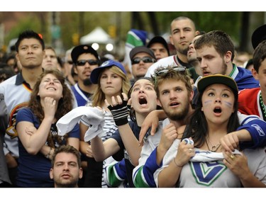 Vancouver B.C.    June 13, 2011 Vancouver Canucks fans were on a roller coaster of emotions as  they watch game 6 slip away in  the Stanley Cup finals against the  Boston Bruins , after being scored on 4 times in the first period,  on  June 13, 2011 in downtown Vancouver.  (Mark van Manen/PNG)   see Vancouver Sun /ProvinceNews and Sports  stories    (Mark van Manen/PNG)    Trax #  00053751H                00053751G      [PNG Merlin Archive]