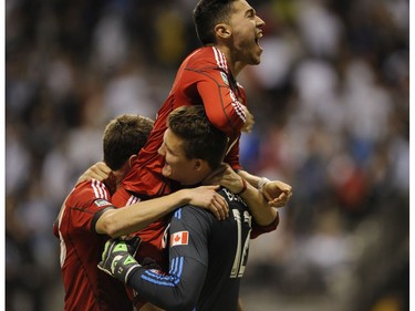 The Toronto F.C celebrates their overtime win against the Whitecaps in B.C. Place during the 2nd match in the Amway championship on May 14, 2014.    Mark van Manen/PNG Staff  Photographer    see  Marc Weber Province Sports Vancouver Sun Sports Gary Kingston /  & Web  stories.