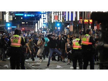 Protesters taunt police on Granville street late into the night during a riot after the Vancouver  Canucks lost to the Boston Bruins  in game 7of the Stanley Cup n Vancouver, B.C.   on  June 15, 2011 (Mark van Manen/PNG)   see Vancouver Sun Iain MacIntyre/ Jim Jamieson Ben Province Sports   stories    (Mark van Manen/PNG)    Trax #  00053791AB                 [PNG Merlin Archive]