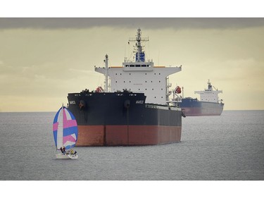 January 17, 2016  Colourful angles-- Freighters at anchor in  English Bay for a story on artists riding to China on freighters and creating art while they are "in residence" on the giant ships.  here  in  Vancouver, , January 17, 2016.    Mark van Manen /PNG Staff photographer   see  Lora Grindlay Province  News stories  /  and Web. stories.    00041283A