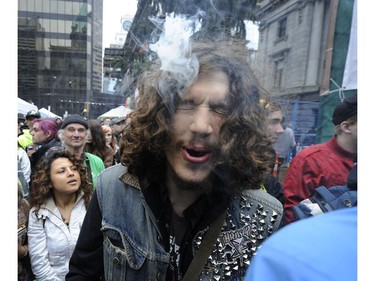 April 20, 2014 -- Big Day to celebrate as thousand gathered in front of Vancouver Art Gallery to take part in the 420 Marijuana smoke in here  in Vancouver on April 20, 2014.    Mark van Manen/PNG Staff  Photographer     see- Ian Austin Province News /Vancouver Sun News & Web  stories.     [PNG Merlin Archive]