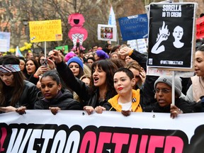 Italian actress Asia Argento (C) and US singer Rose McGowan, who both accuse Harvey Weinstein of sexual assault, take part in a march organised by 'Non Una Di Meno' (Me too) movement on March 8, 2018 as part of the International Women's Day in Rome.