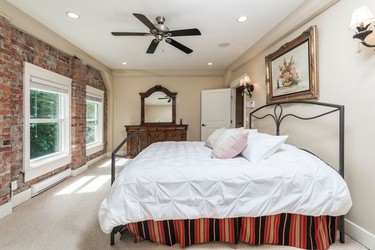A bedroom in a house at 39623 Old Yale Road in Abbotsford, B.C. is shown in a handout photo. Bidding opens Tuesday on the 12-bedroom, 10-bath restored train power station listed as the "Sumas Powerhouse," which previously sold for $5 million.