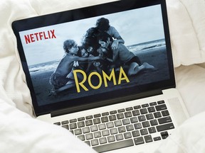 The home screen for the Netflix Inc. original movie "Roma" is seen on an Apple Inc. laptop computer in this arranged photograph taken in the Brooklyn Borough of New York, U.S., on Sunday, Jan. 13, 2019. Netflix is scheduled to release earnings on January 17.