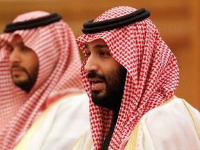 In this Feb. 22, 2019, file photo, Saudi Crown Prince Mohammad bin Salman, right, speaks to Chinese President Xi Jinping during a meeting at the Great Hall of the People in Beijing.