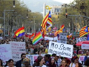 People march during a protest against the emergence of a far right party in Spain ahead of next month's national elections in Barcelona, Spain, Saturday, March 23, 2019. Spain hadn't had a far-right party for years until Vox erupted onto the political scene by winning representation in regional elections in the country's south in December.