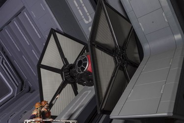 Disney Imagineers view a life-size TIE fighter as they work on Star Wars: Rise of the Resistance at Star Wars: Galaxy's Edge.