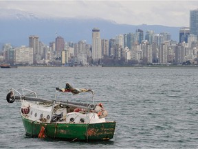A 2010 file photo of a derelict sailing boat moored in English Bay off Jericho Beach in Vancouver.