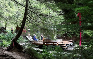 Visitors relax at the Aiyansh hot springs about 17 km west of New Aiyansh in northwestern British Columbia on Saturday, Sept. 1, 2018.