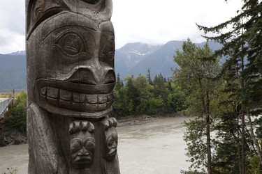 One of four totem poles on the corners of a bridge over the Nass River to Gitwinksihlkw (Canyon City) in northwestern British Columbia is seen on Saturday, Sept. 1, 2018. The eight-metre tall poles each represent a different animal crest of the Nisga'a people.