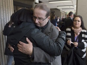 Glen Assoun is embraced by family members at Nova Scotia Supreme Court in Halifax on March 1, 2019. Glen Assoun's lawyer says the wrongfully convicted Halifax man suffered "every single day" as he waited to be exonerated for a murder he didn't commit -- a wait that was prolonged for months as his case sat on former justice minister Jody Wilson-Raybould's desk. David Lametti issued an order for a new trial on Feb. 28, just seven weeks after taking over as justice minister. The following day -- after a five-minute new trial in which the prosecution presented no evidence -- Assoun was a free man.