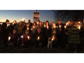 A group opposed to an airport expansion project in the Richmond community of Burkeville held a vigil Friday night for 13 trees chopped down by YVR crews in Templeton Park.