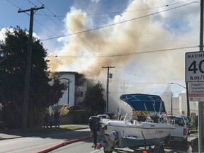 Smoke billows from the Lindsay Place apartment complex at 843 Craigflower Rd. in Esquimalt.