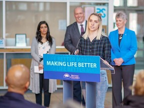 Makayla Waldenberger, a recipient of the government's tuition fee waiver program for former youth in care, speaks April 16 at a press conference at Douglas College's Coquitlam campus alongside government ministers and Premier John Horgan.