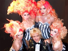 Barrie, Ont. hair stylist Suzanne Martin's models Bailey Madill, Jessica Blanco, Amanda Leigh and Chelsea Brennan ringed Show It Off coiffure event co-producer Jon Paul Holt at the Vancouver Playhouse.