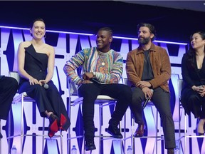 CHICAGO, IL - APRIL 12:  (L-R) Daisy Ridley (Rey), John Boyega (Finn), Oscar Isaac (Poe Dameron) and Kelly Marie Tran (Rose Tico) onstage during "The Rise of Skywalker" panel at the Star Wars Celebration at McCormick Place Convention Center on April 12, 2019 in Chicago, Illinois.