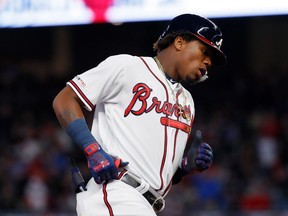 Ronald Acuna Jr. of the Atlanta Braves rounds third base after hitting a solo home run to lead off the third inning of a National League game against the Chicago Cubs on April 1, 2019 in Atlanta, Ga.