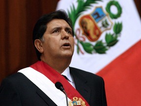 In this file picture taken on July 28, 2006 Peru's then-President Alan Garcia sings the national anthem during his inauguration at the Congress in Lima.