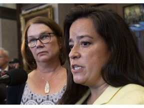 Independent MPs Jane Philpott and Jody Wilson-Raybould speak with the media before Question Period in the Foyer of the House of Commons in Ottawa, Wednesday April 3, 2019. Former cabinet minister Philpott says Prime Minister Justin Trudeau violated the law when he expelled her and Wilson-Raybould from the Liberal caucus.THE CANADIAN PRESS/Adrian Wyld