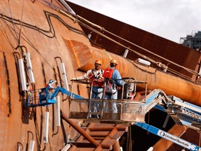 Contractors work on the hull of Anadarko Petroleum Corp.'s Lucius truss spar at the Kiewit Offshore Services facility in Ingleside, Texas.