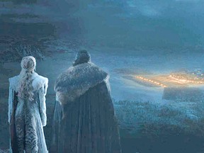 Jon Snow and Daenerys watch from afar as Winterfell lights up, prepared to face the Night King and his army.