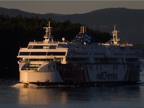 The B.C. Ferries vessel Coastal Celebration travels between Mayne Island and Galiano Island during a sailing from Swartz Bay on Vancouver Island to Tsawwassen at sunrise on Nov. 10, 2014.