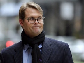 Mark Riddell arrives at federal court Friday, April 12, 2019, in Boston, where he was scheduled to plead guilty to charges in a nationwide college admissions bribery scandal.