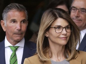 The Vancouver-filmed When Calls The Heart will resume its sixth season next month – without Lori Loughlin. In this April 3, 2019 file photo, Loughlin, front, and husband, clothing designer Mossimo Giannulli, left, depart federal court in Boston after facing charges in a nationwide college admissions bribery scandal.