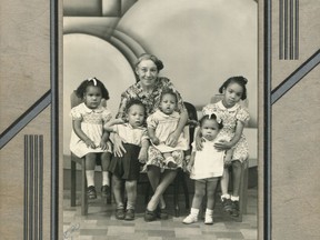 Emily Aida Collins is shown with her grandchildren: (L to R) Charlotte, Richard, Judith and Bernice with her arms around Gail. Years after her first husband died, Emily defied convention by marrying Charles Collins, a Black Jamaican in Canada since 1886. Together they had four bi-racial sons whose children appear in this 1944 photo. Emily knew Yucho Chow welcomed everyone and would help her capture the special occasion: her grandson Richard's second birthday.