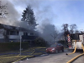 Vancouver firefighters battle a house fire in the 2600 Lynbrook Drive.