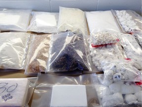 Drugs, weapons, ammunition, cash and vehicles were seized as part of the general investigation called Project Trooper and put on display April 1, 2015 by the Vancouver police department.