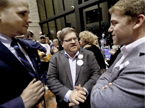 Mike Wessell (centre), a Republican-turned Democrat, talks with other supporters for Democratic party candidate for Pennsylvania state senator Pam Iovino at her election returns party in Pittsburgh on April 2, 2019. Some Democrats thought they didn’t need white male voters in 2016, but the party knows it needs them in 2020.