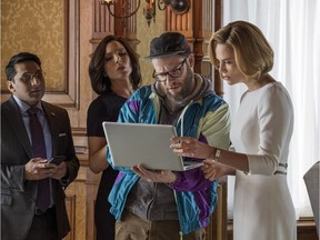 Fom left Ravi Patel, June Diane Raphael, Seth Rogen and Charlize Theron in a scene from Long Shot. Philippe Bossé/Lionsgate via AP