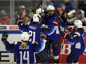 Team of USA celebrate a goal during the 2019 IIHF Women's World Championships preliminary match between USA and Canada in Espoo, Finland, Saturday April 6, 2019.