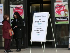 Signs about measles and the measles vaccine are displayed at the Rockland County Health Department in Pomona, N.Y., Wednesday, March 27, 2019.The county in New York City's northern suburbs declared a local state of emergency Tuesday over a measles outbreak that has infected more than 150 people since last fall, hoping a ban against unvaccinated children in public places wakes their parents to the seriousness of the problem.