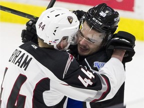 Bowen Byram of the Vancouver Giants scraps with Victoria Royals' Brandon Cutler in a chippy, low-scoring affair in Game 2 of their WHL second-round playoff series at the Langley Events Centre on Saturday.