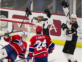 Vancouver Giants Justin Sourdif and Davis Koch celebrate after scoring a 2-0 goal against Spokane Chiefs goalie Bailey Brkin in Game 5 of the WHL Western Conference Championship in Langley April 26, 2019.