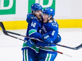 How to get more offence? For starters, the Canucks will be looking to sophomore Elias Pettersson (left) and third-year winger Brock Boeser — both of whom are under 23 — to score more.