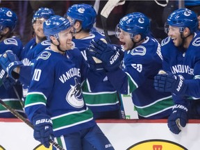 Vancouver Canucks' Tanner Pearson, Bo Horvat and Josh Leivo celebrate Pearson's shootout goal against the Los Angeles Kings in late March.