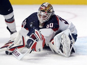 USA's goaltender Thatcher Demko makes a save during first period preliminary round hockey action against Canada at the IIHF World Junior Championship Wednesday, December 31, 2014 in Montreal.