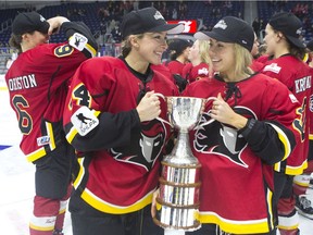 Calgary Inferno's Zoe Hickel, left, and Tori Hickel celebrate after beating Les Canadiennes de Montreal 5-2 to win the 2019 Clarkson Cup game in Toronto on March 24 , 2019. The Canadian Women's Hockey League's board of directors have decided to discontinue operations May 1 of this year.